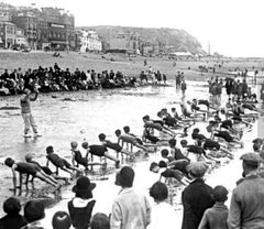 Children-doing-fitness-exercises-on-Pelham-Beach.-1925.